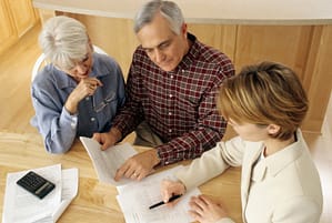 Attorney with Clients Signing Legal Documents